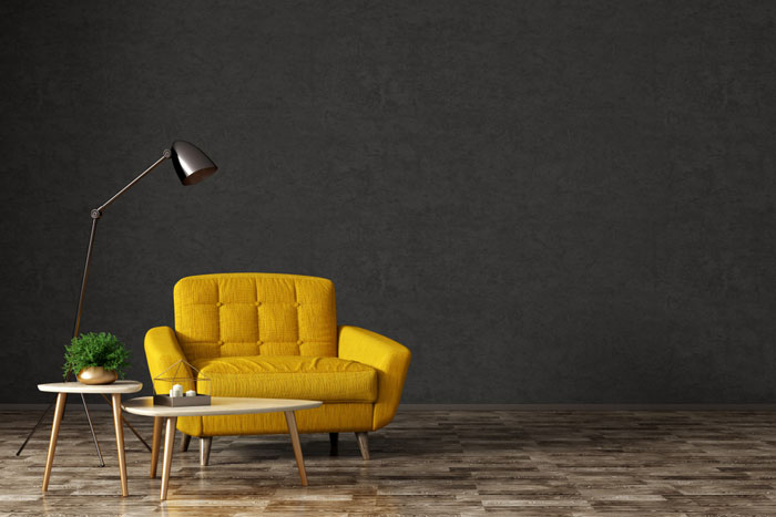 Brightly coloured chair and side table on domestic wooden floor in Warrington